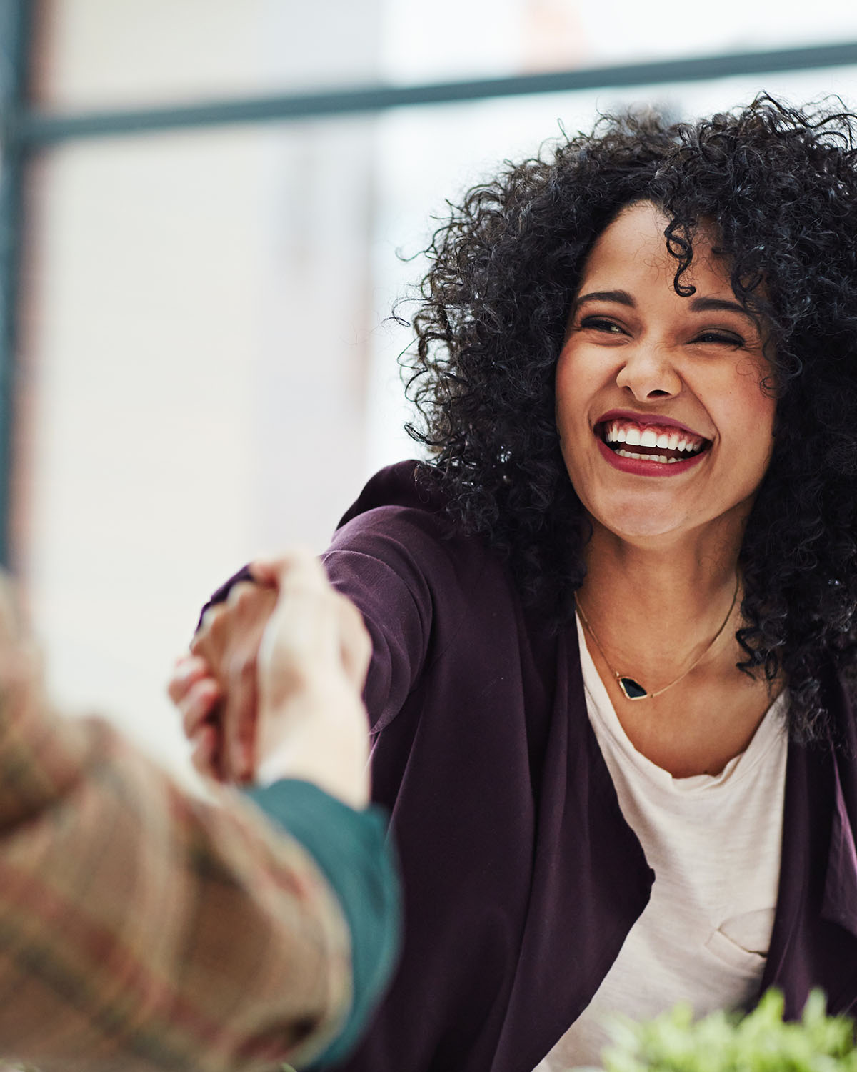 Photo of a happy business woman with High-Key Visibility and a Low-Key Life.